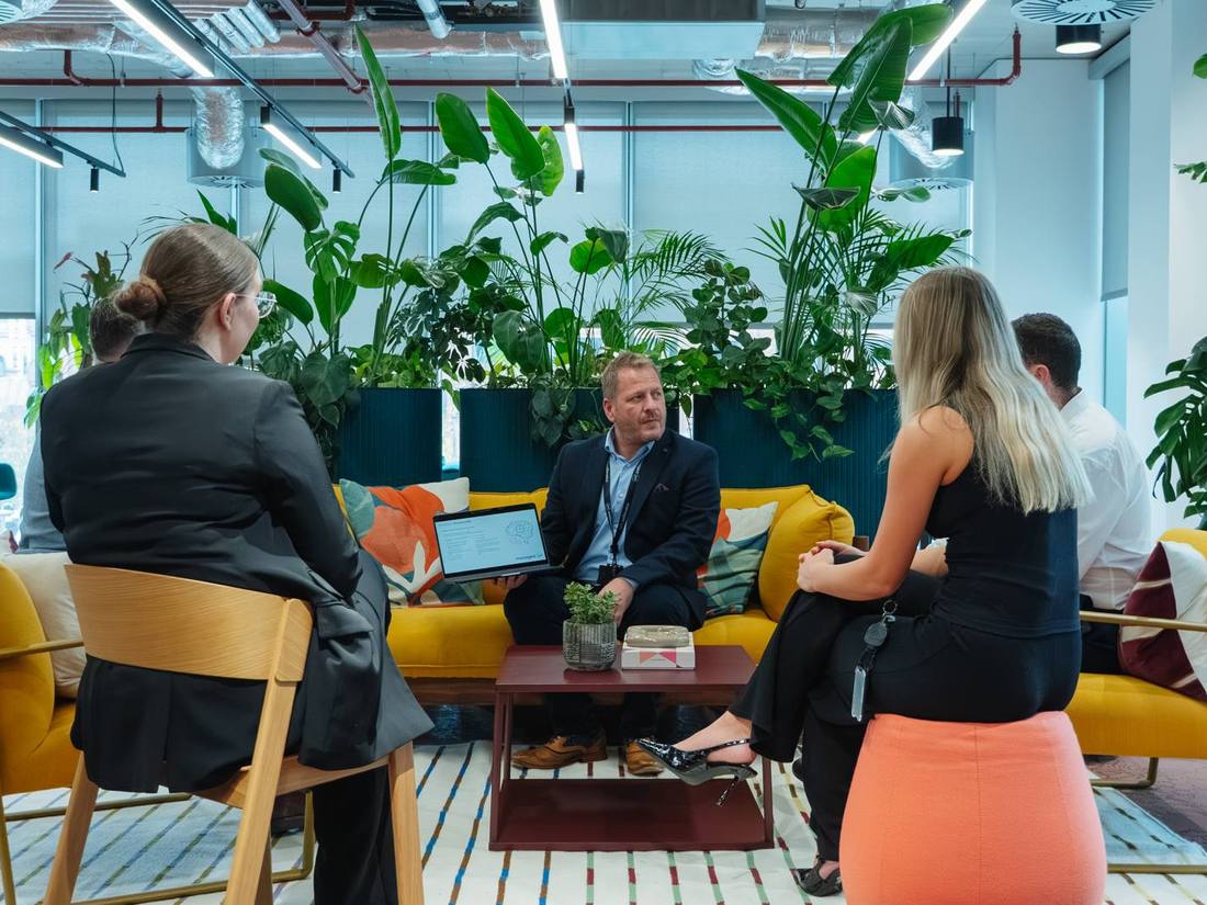 The Managed247 team collaborating in the office