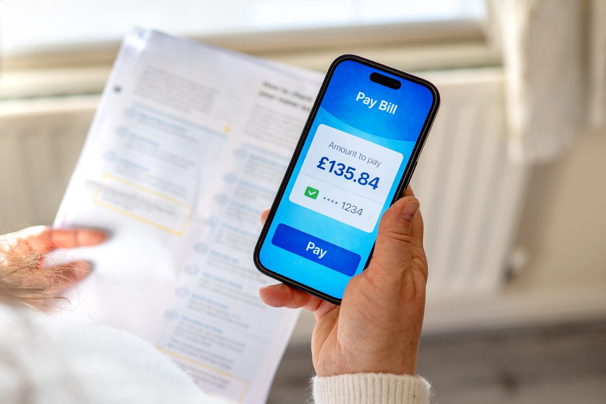 A customer paying a bill on a banking app from their phone