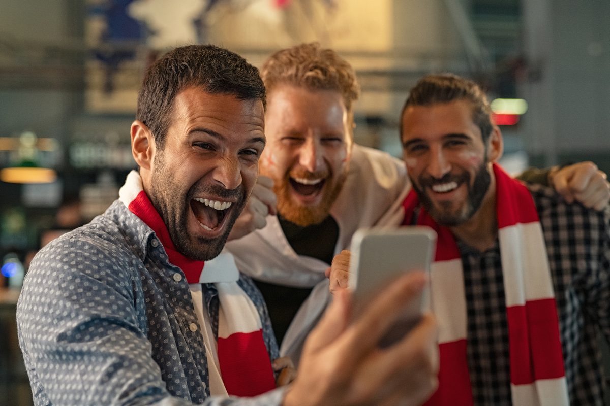 Sports fans using technology at a venue