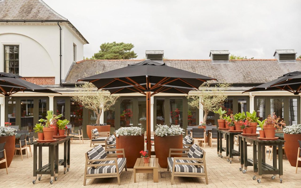 The Stables Courtyard at The Grove, set for outdoor dining and drinks